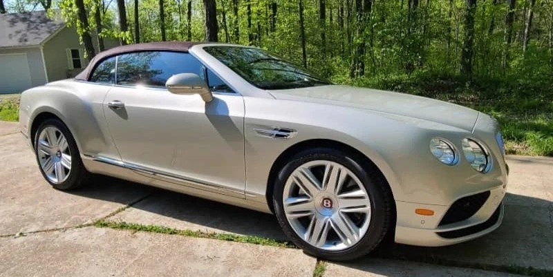 A car with a gleaming, reflective finish after applying a ceramic coating, highlighting its glossy and protective benefits.