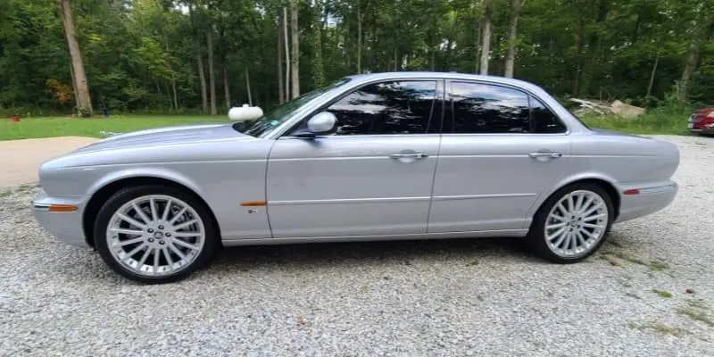 A gleaming car with a freshly polished exterior, highlighting the shine and protective benefits of professional auto detailing.